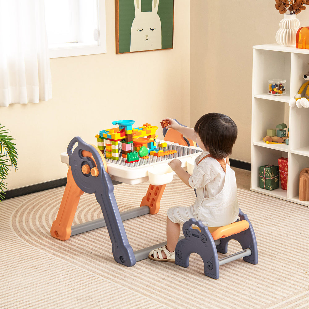 Kids art easel with reversible building block tabletop, featuring a child playing with colorful blocks in a cozy room.