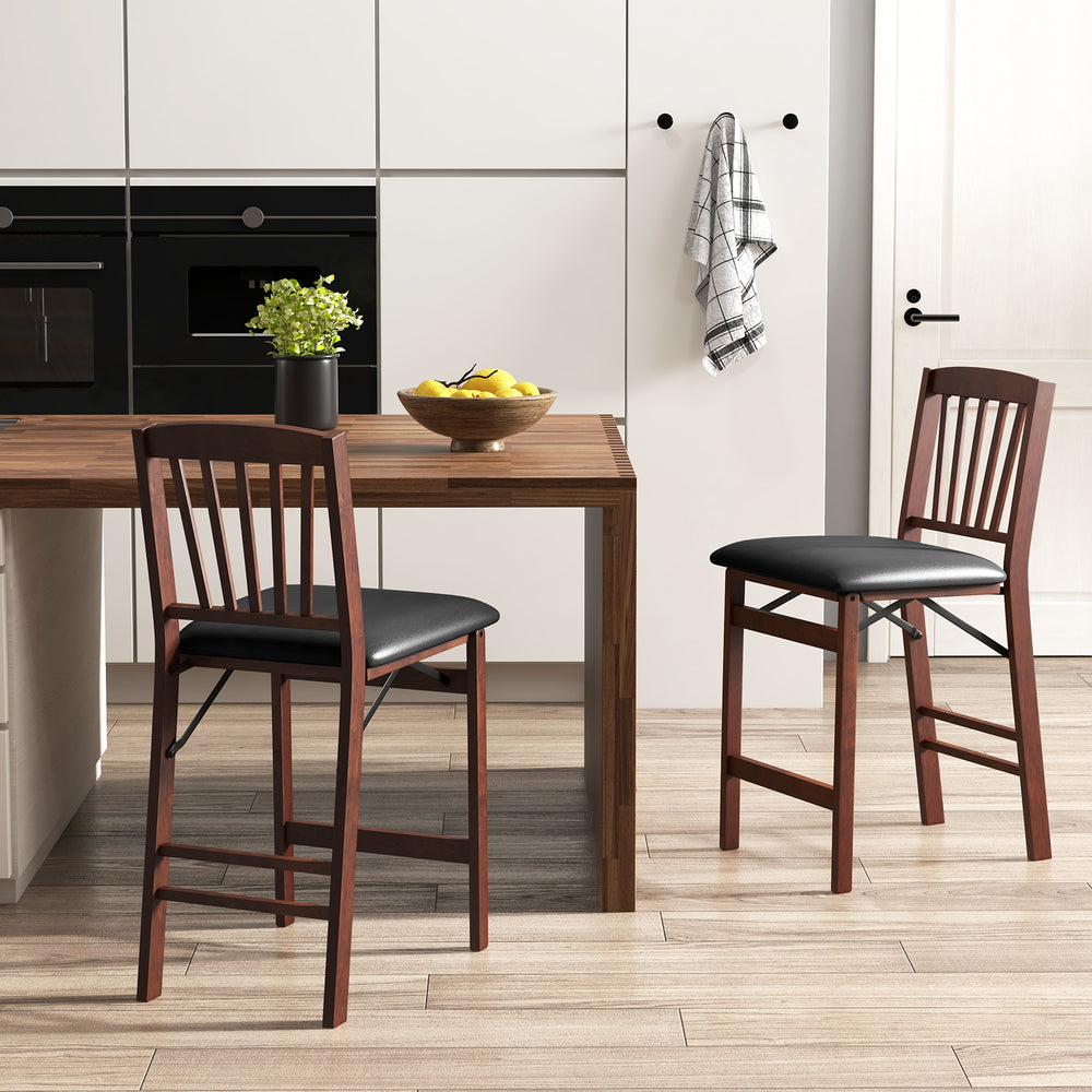 Set of 2 brown folding counter height chairs with padded seats and ergonomic backrest for kitchen island use.