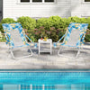 Two blue folding low beach chairs with padded head pillows and a small table, perfect for relaxing by the pool.