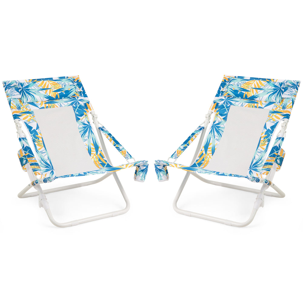 Set of 2 folding low beach chairs with tropical print, padded headrest, and cup holder for comfortable outdoor lounging.
