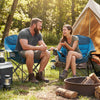 Two people enjoying time together in oversized blue camping chairs with cup holders, ideal for outdoor adventures.