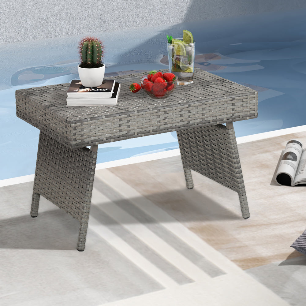 Folding gray PE rattan side coffee table with wide top, perfect for outdoor use and summer relaxation.