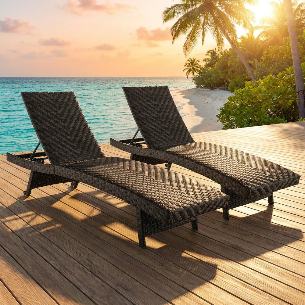 Set of 2 folding padded rattan chaise lounges with adjustable backrests, perfect for poolside relaxation and easy storage.