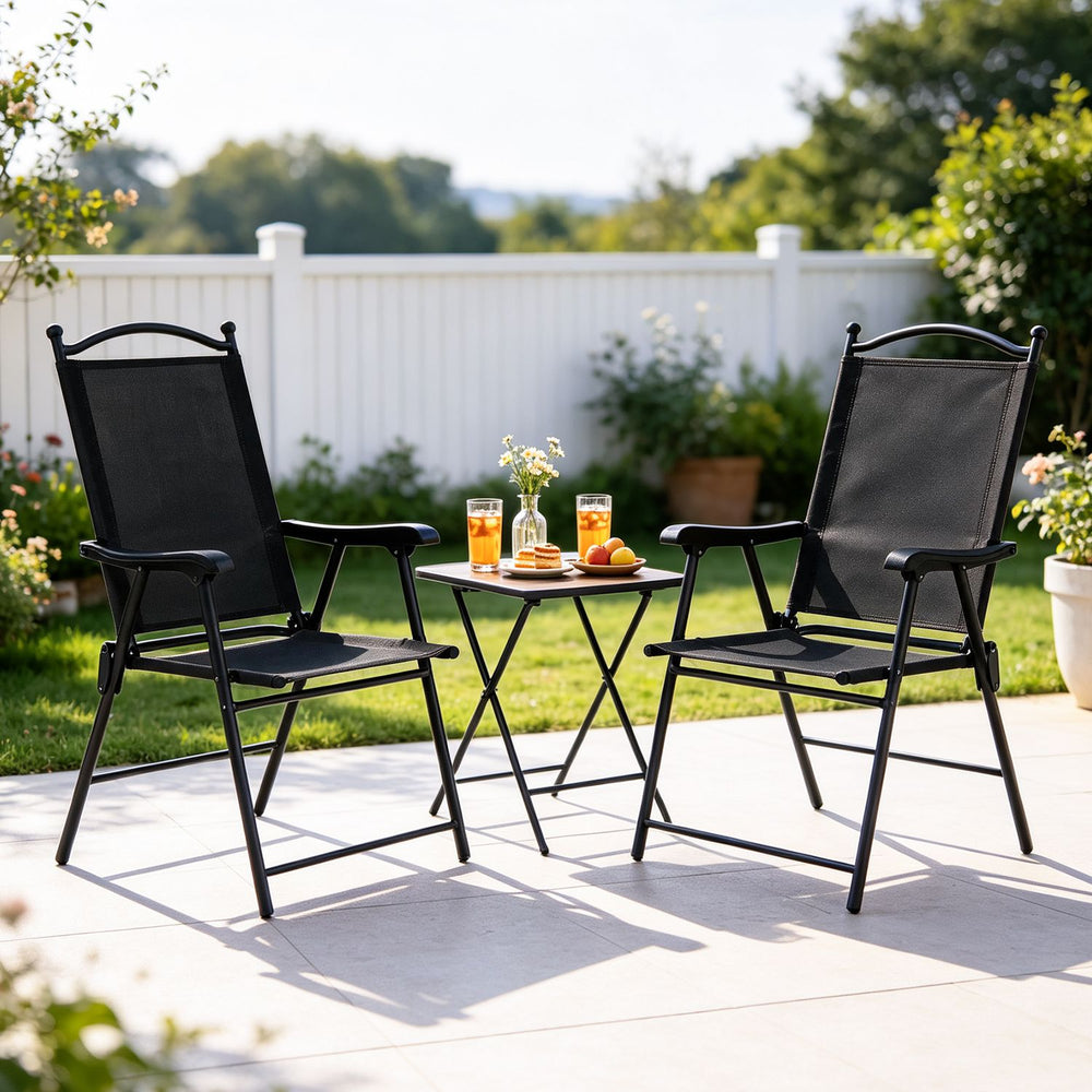 Folding black patio chairs with high back and armrests, perfect for outdoor relaxation on the lawn or deck.