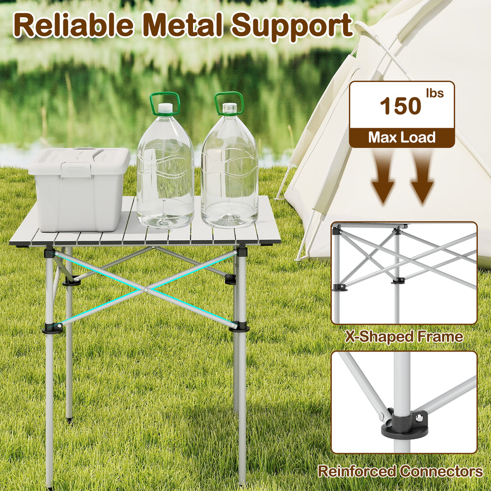 Folding roll-up camping table with metal legs, featuring a sturdy X-shaped frame and aluminum tabletop for outdoor use.