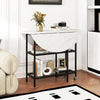 Folding round dining table with white faux marble top and black metal frame, featuring lockable wheels and two shelves.