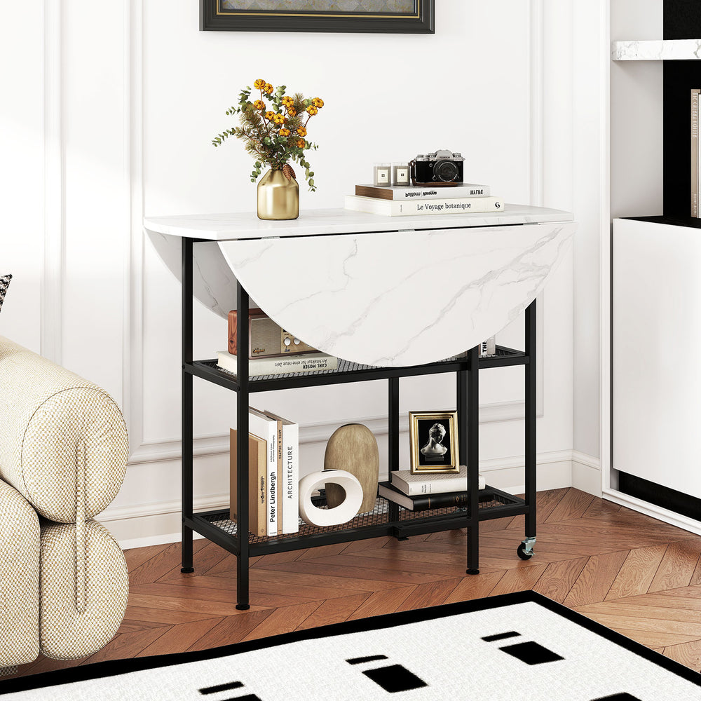 Folding round dining table with white faux marble top and black metal frame, featuring lockable wheels and two shelves.