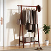 Folding rubber wood clothes hanging rack in walnut finish with bottom storage shelf for organized entryway or bedroom.