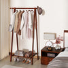 Folding rubber wood clothes hanging rack in walnut with bottom storage shelf, perfect for bedroom or hallway.
