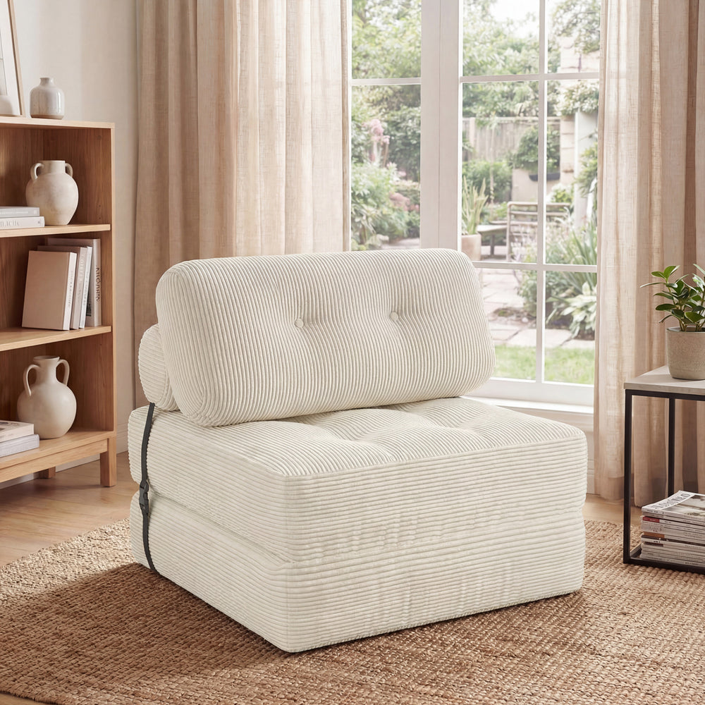 Folding sofa bed in beige with back support, featuring soft corduroy and a button design, ideal for living rooms.