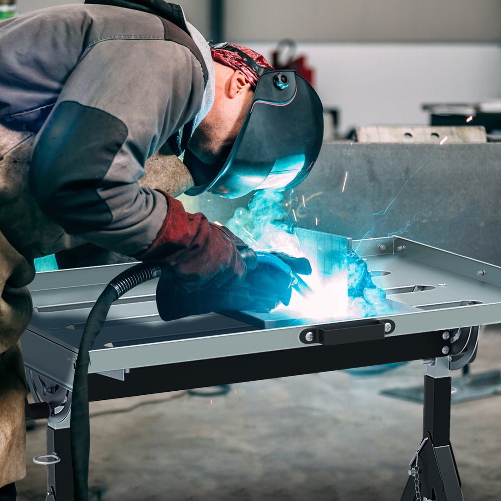Folding welding table with adjustable height and tiltable tabletop, designed for efficient welding and tool.