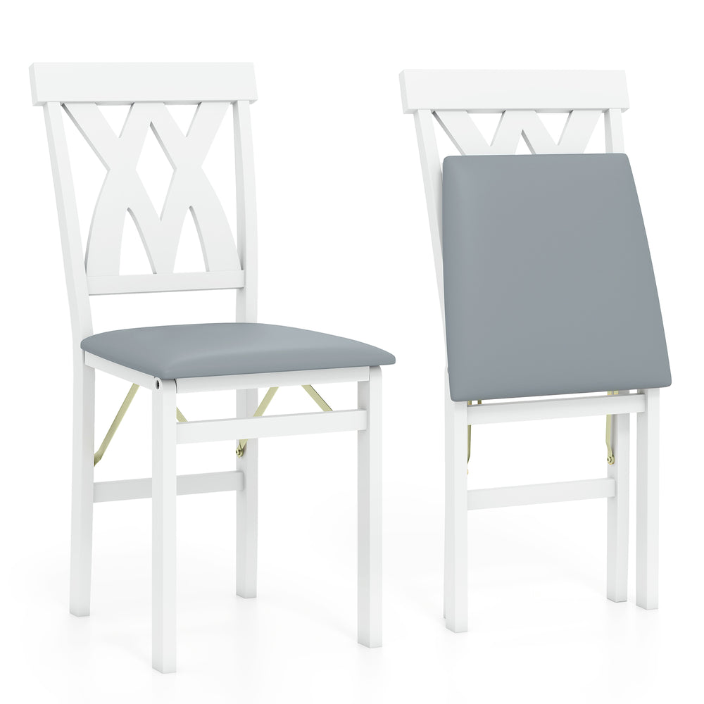 Folding wooden dining chair set of 2 in white with faux leather upholstery, ideal for small spaces and easy to clean.
