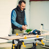 Folding work table with adjustable height and tiltable platform, featuring clamps and sturdy aluminum construction for.