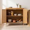 Bamboo bathroom storage cabinet with two doors, featuring ventilated hollowed-out doors and sturdy elevated legs for durability.