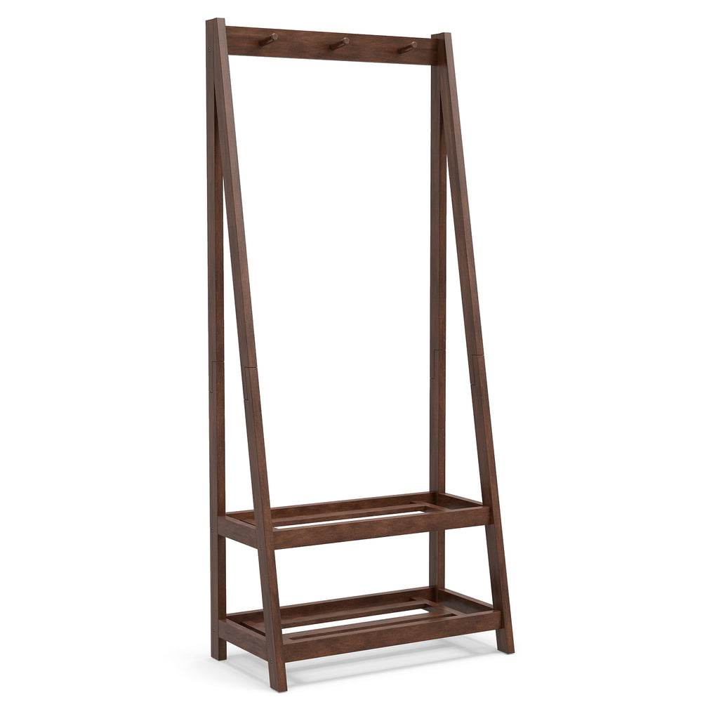 Freestanding clothes rack in walnut with 3 hooks and 2 shelves, perfect for bedroom or entryway storage.