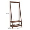 Freestanding clothes rack in walnut with 3 hooks and 2 shelves, ideal for bedroom or entryway storage.