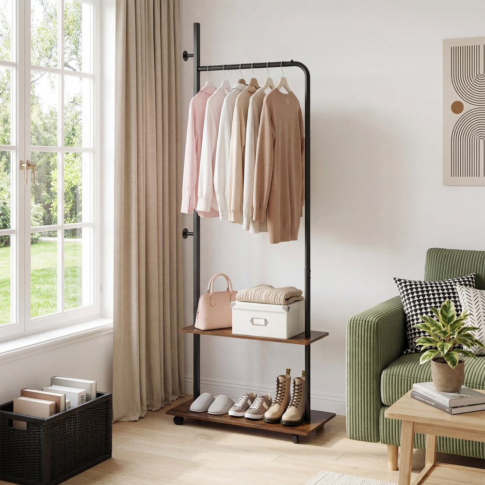 Freestanding clothing rack in rustic brown with hanging rod, storage shelves, and wheels for easy mobility in any room.