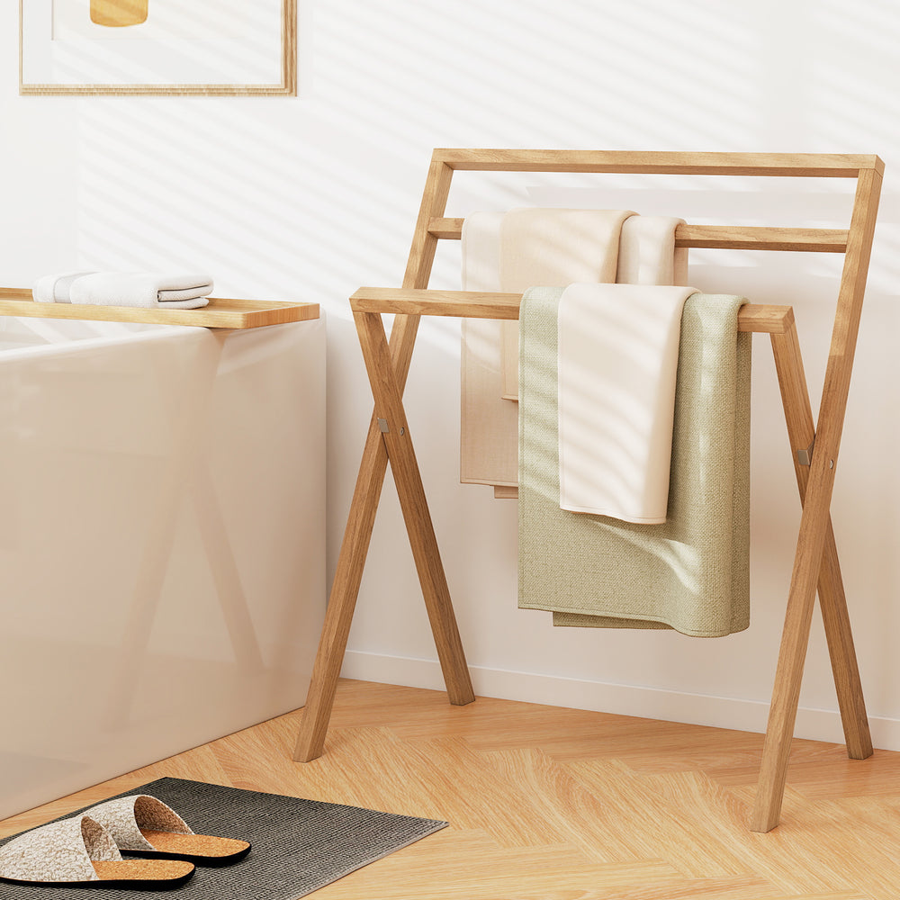 Freestanding foldable teak wood towel rack with three hanging crossbars, perfect for drying towels in any room.