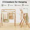 Freestanding foldable teak wood towel rack with 3 crossbars, ideal for drying towels in bathrooms or laundry rooms.
