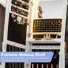 Foldable makeup shelf in a white jewelry armoire, featuring LED lights and ample storage for cosmetics and tools.