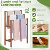 Freestanding solid wood towel rack with teak oil finish, featuring three tiers for organized drying in any room.