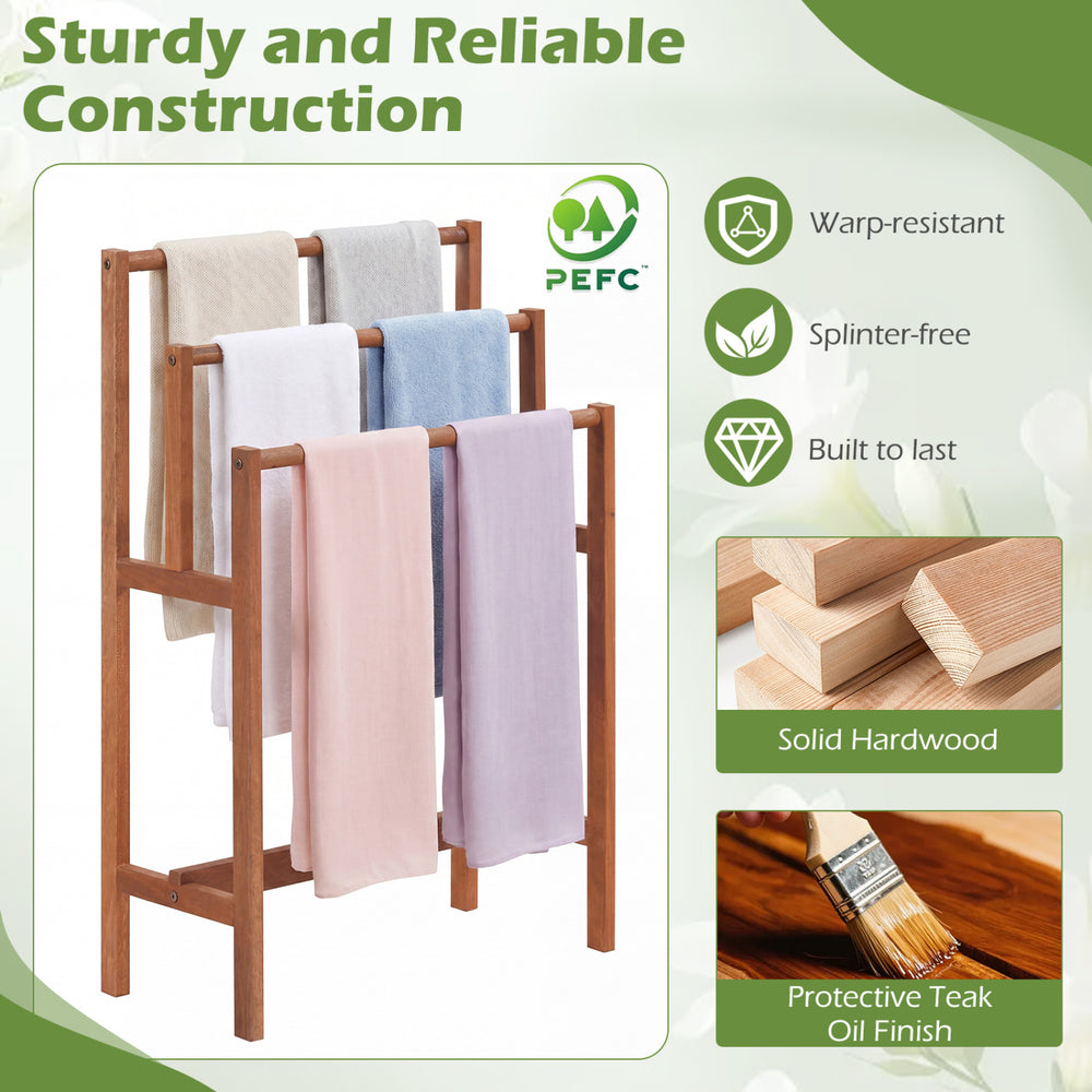 Freestanding solid wood towel rack with teak oil finish, featuring three tiers for organized drying in any room.