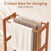 Freestanding towel rack with three hanging bars in solid wood, perfect for keeping towels dry in any room.