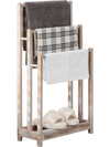 Freestanding towel rack with three bars and bottom storage shelf, made of solid fir wood, ideal for drying towels.