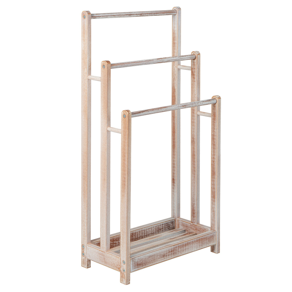 Freestanding 3-bar towel rack in white with a bottom storage shelf, made of solid fir wood for effective drying.