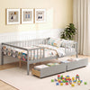 Full-size gray daybed with fence and two pull-out drawers, featuring side storage for children's items and safety.