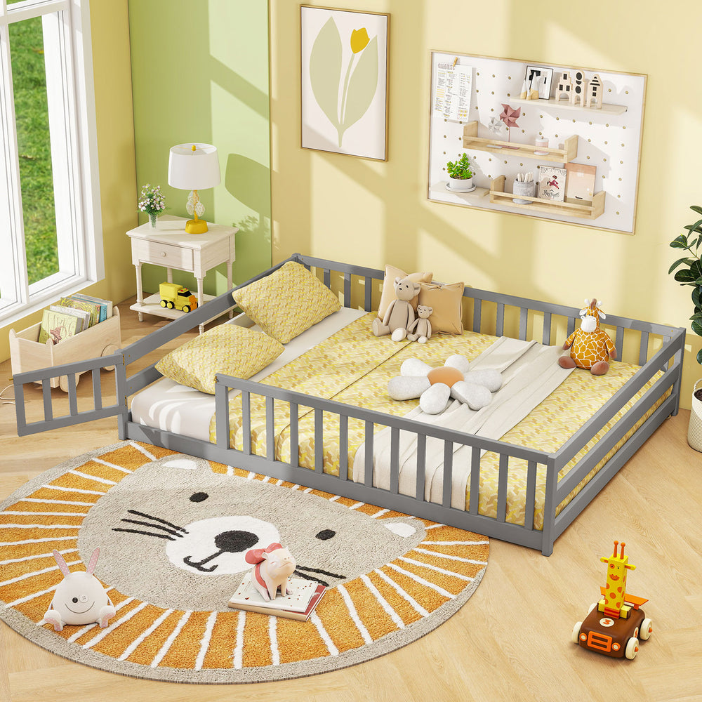 Full-size gray floor bed with safety guardrails, ideal for kids' sleeping and play, featuring a low-to-ground design.