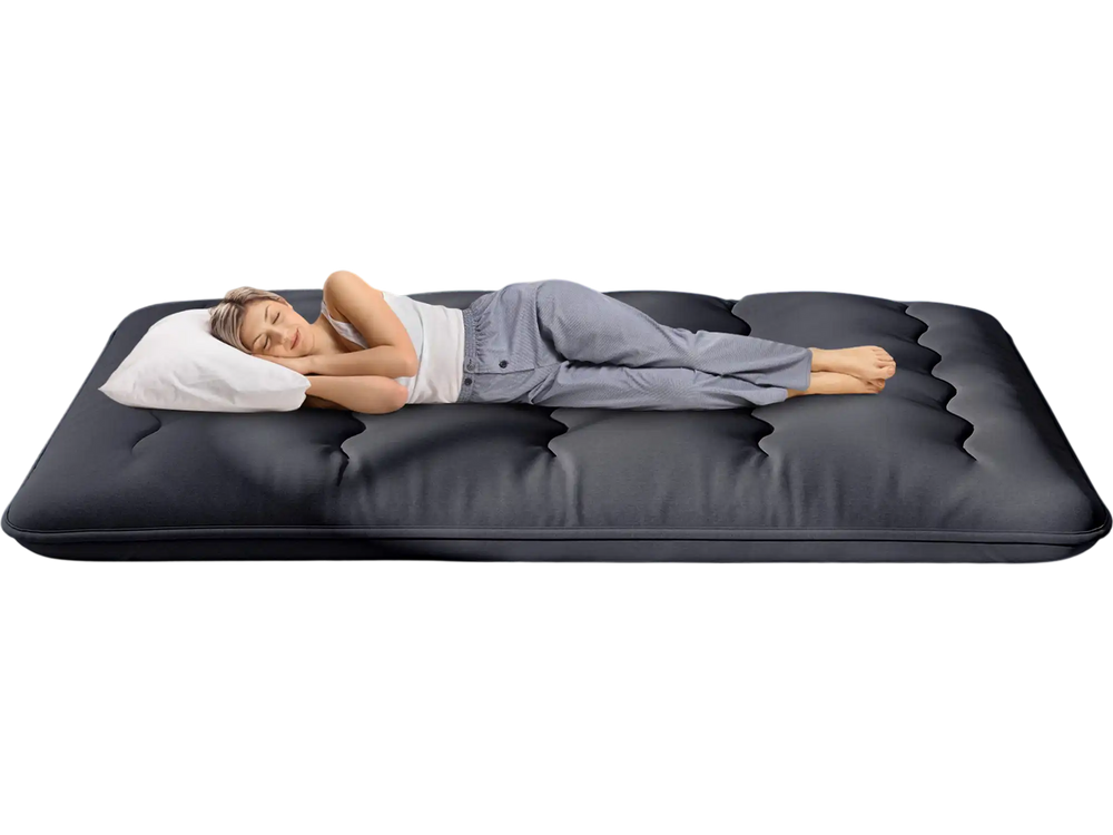 Futon mattress with washable cover, featuring a foldable design, shown in a cozy living room setting for versatile use.