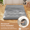 Futon mattress with washable cover, featuring quilted design and carry bag, ideal for camping or as a sleeping pad.