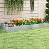 Galvanized metal landscape edging in a garden bed, featuring colorful flowers and a neat border for landscaping.
