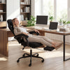 Height adjustable gaming chair in black with headrest, reclining backrest, and retractable footrest for optimal comfort.