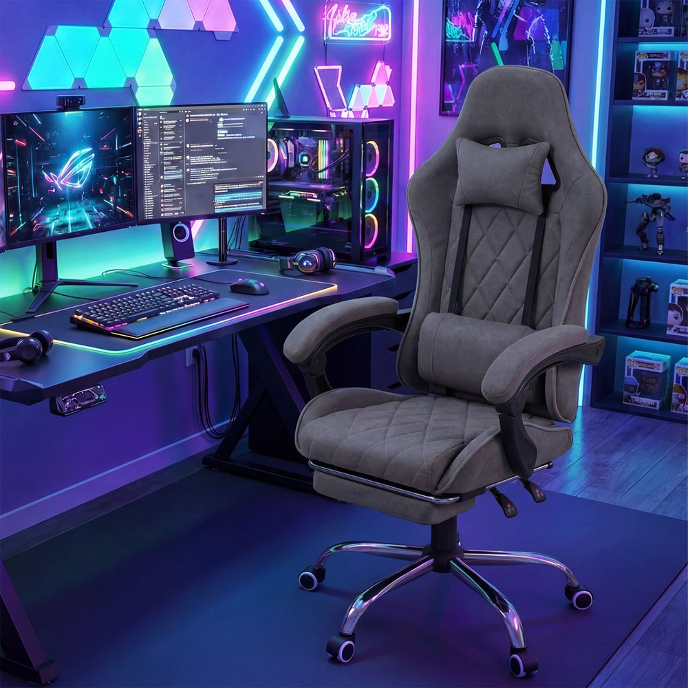 Gaming chair in gray with ergonomic design, adjustable height, headrest, and lumbar support for comfortable gaming.