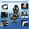 Gaming chair with ergonomic design, adjustable height, padded armrests, and retractable footrest for optimal comfort.