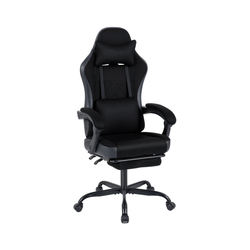 Height adjustable black gaming chair with headrest, lumbar support, and retractable footrest for optimal comfort.