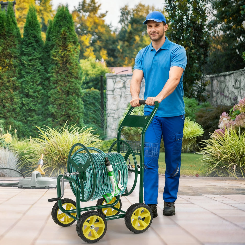 Garden hose reel cart in green with 4 wheels, storage basket, and foam-padded handrail for easy maneuvering.