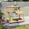 Wooden garden potting bench with lattice trellis, compact design, and lower shelf, ideal for balconies and porches.