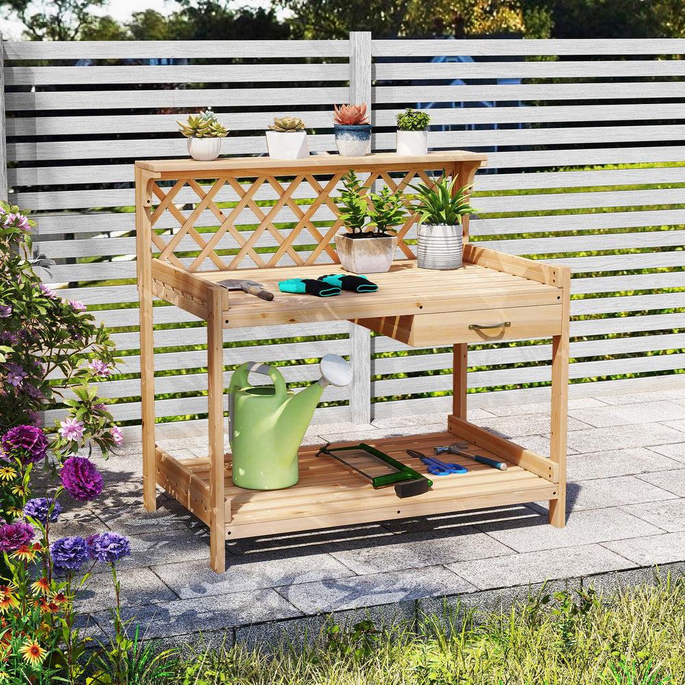 Wooden garden potting bench with lattice trellis, compact design, and lower shelf, ideal for balconies and porches.