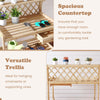 Wooden garden potting bench with spacious countertop and versatile trellis, perfect for displaying plants and.