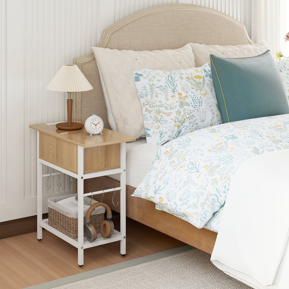 Natural wood end table with charging station, USB ports, and flip top, featuring a bottom shelf and S hooks for storage.