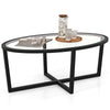 Oval glass coffee table with black cross base and acacia wood legs, perfect for living room decor and stability.
