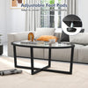 Oval glass coffee table with black cross base and acacia wood legs, featuring adjustable foot pads for stability.