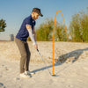 Right-handed golfer using a 56-degree sand wedge on the course, showcasing its milled grooves and durable stainless.