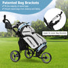 Three-wheeled gray golf push cart with adjustable handle, seat, and patented bag brackets for stability on the course.