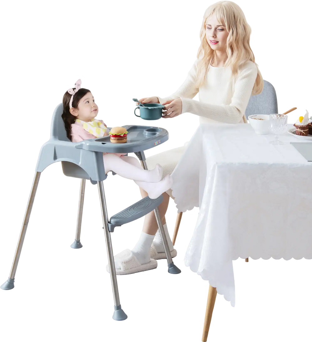 Convertible gray baby high chair with removable double tray, featuring a safety harness and smooth, easy-to-clean seat.