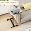 Gray overbed rolling table with 360° swivel tabletop, adjustable height, and wheeled base for versatile use.
