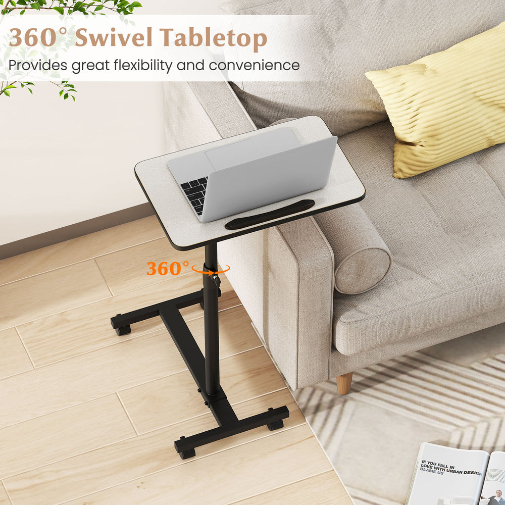 Gray overbed rolling table with 360° swivel tabletop, adjustable height, and wheeled base for versatile use.